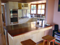 Timber veneer kitchen with stainless steel & solid timber benchtops
