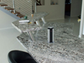 Granite benchtop with upstand and lift-up powerpoints