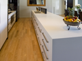 White kitchen with Ceasarstone benchtops and glass splash